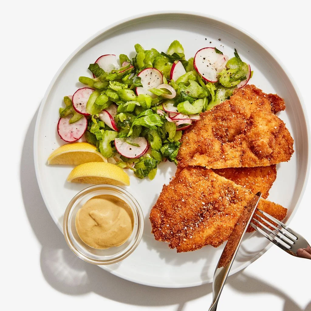 Image may contain Dish Food Meal Human Person Platter and Fried Chicken