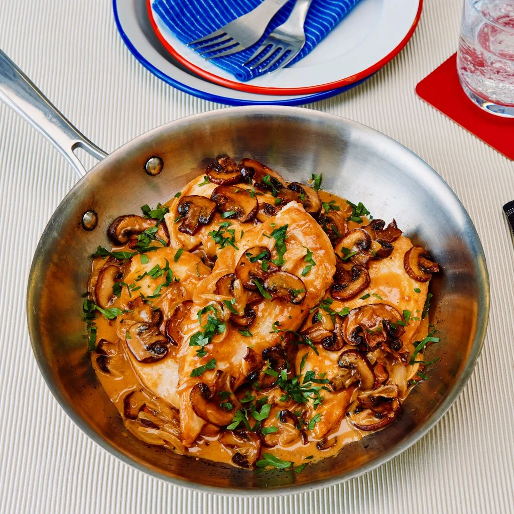 Speedy Chicken Stroganoff in a skillet with a spoon