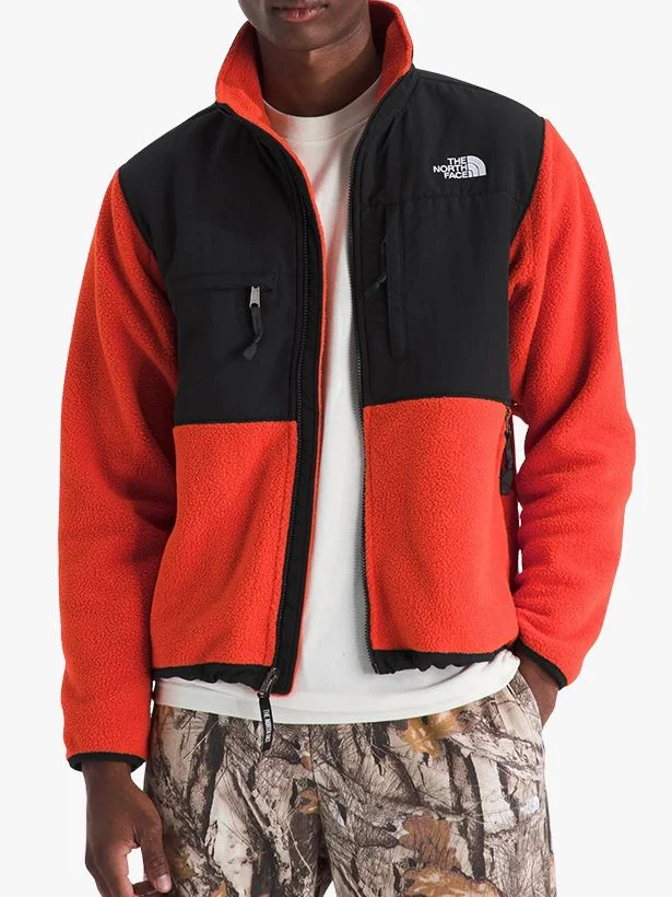 Image may contain Clothing Coat Jacket Vest Fleece Hoodie Knitwear Sweater and Sweatshirt