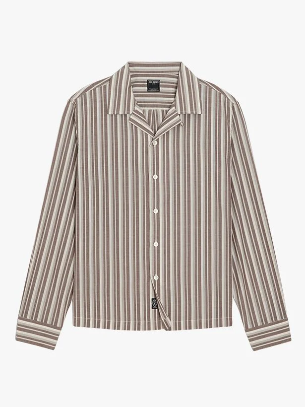 Image may contain Clothing Shirt Dress Shirt Long Sleeve Sleeve and Blouse
