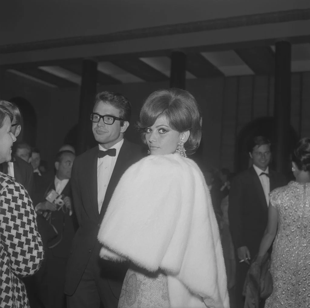 Image may contain Claudia Cardinale Warren Beatty Clothing Formal Wear Suit Tuxedo Coat Accessories and Glasses