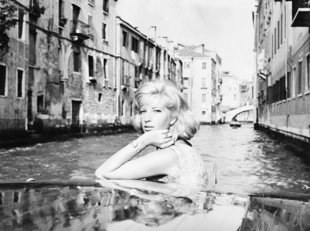 Image may contain Monica Vitti Face Head Person Photography Portrait City Water Waterfront Child and Urban
