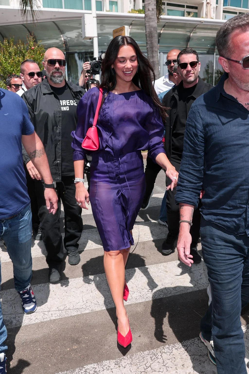 Image may contain Dua Lipa Adrian McKinty Seth Gueko Adult Person Photobombing Accessories Bag and Handbag