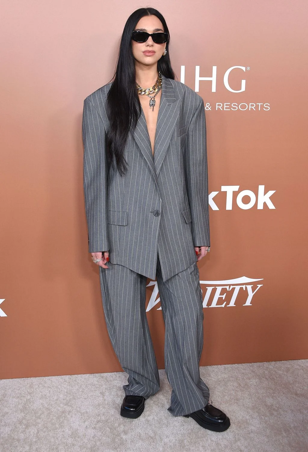 At Varietys Hitmakers brunch wearing a suit by The Attico with Prada sunglasses and Marni loafers.