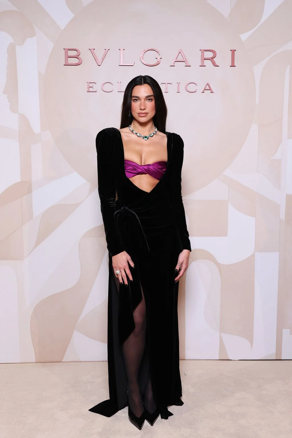 Image may contain Dua Lipa Adult Person Clothing Dress Formal Wear Long Sleeve Sleeve Velvet and Evening Dress