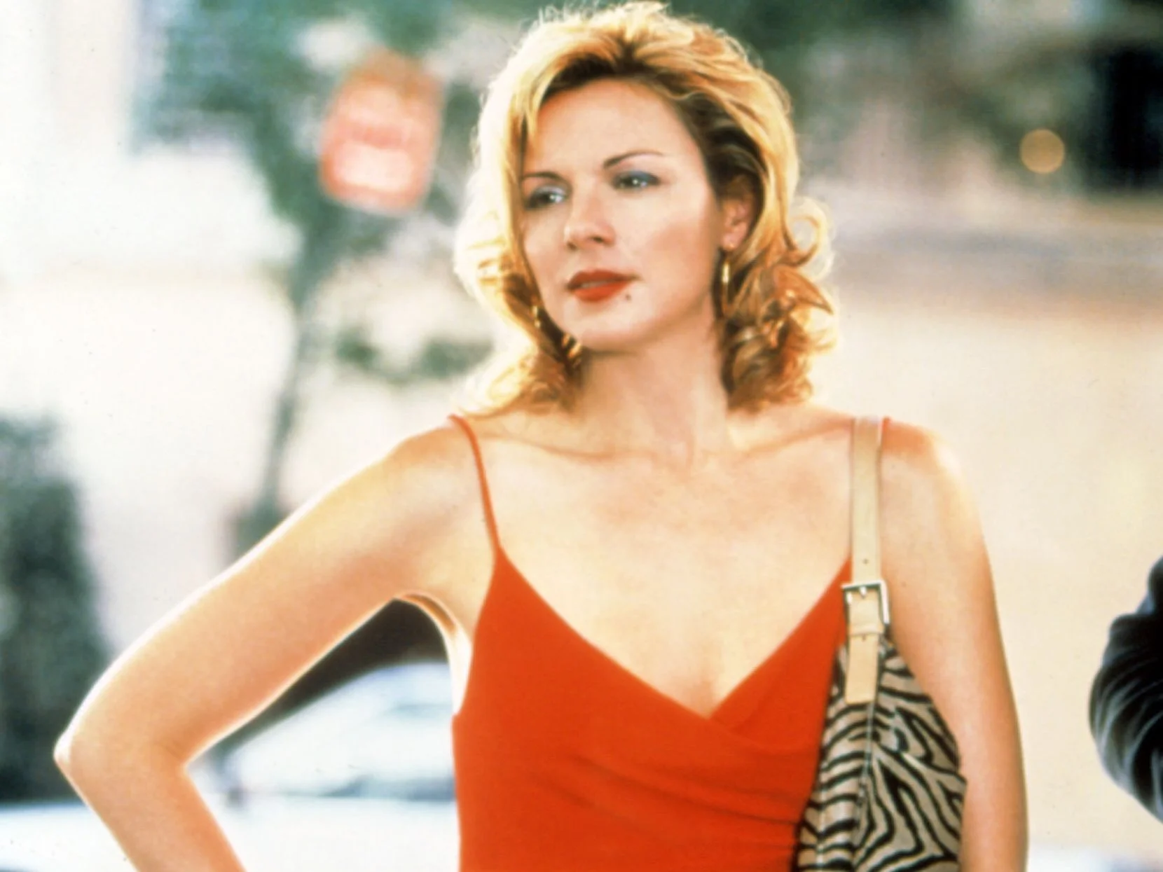 Image may contain Kim Cattrall Clothing Dress Adult Person Formal Wear Face Head Photography and Portrait