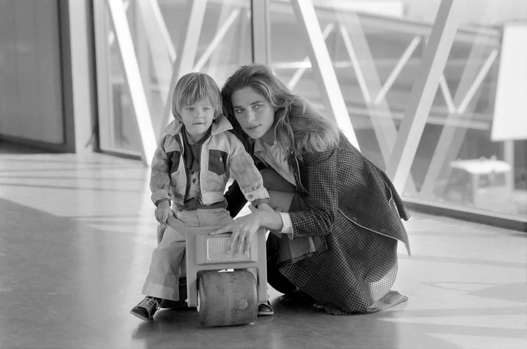 Image may contain Charlotte Rampling Clothing Coat Face Head Person Photography Portrait Adult Child and Jacket