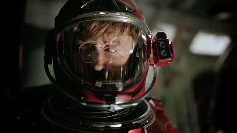 Ryland Grace (Ryan Gosling) wearing a spacesuit with his glasses askew inside the helmet in Project Hail Mary