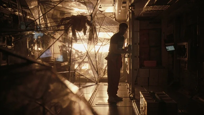 Rocky (James Ortiz) and Grace (Ryan Gosling) discuss science in Project Hail Mary