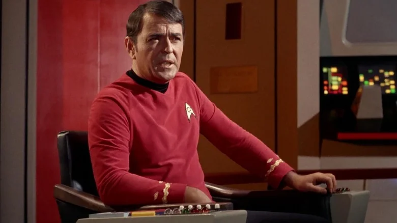 Scotty in the captain's chair on Star Trek