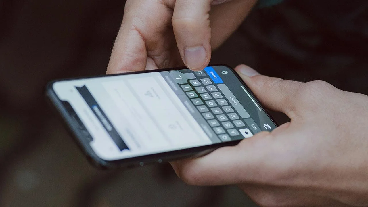 Image of person holding phone 