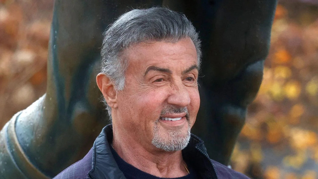 Image of Sylvester Stallone had to share a bathroom with 10 other people. 