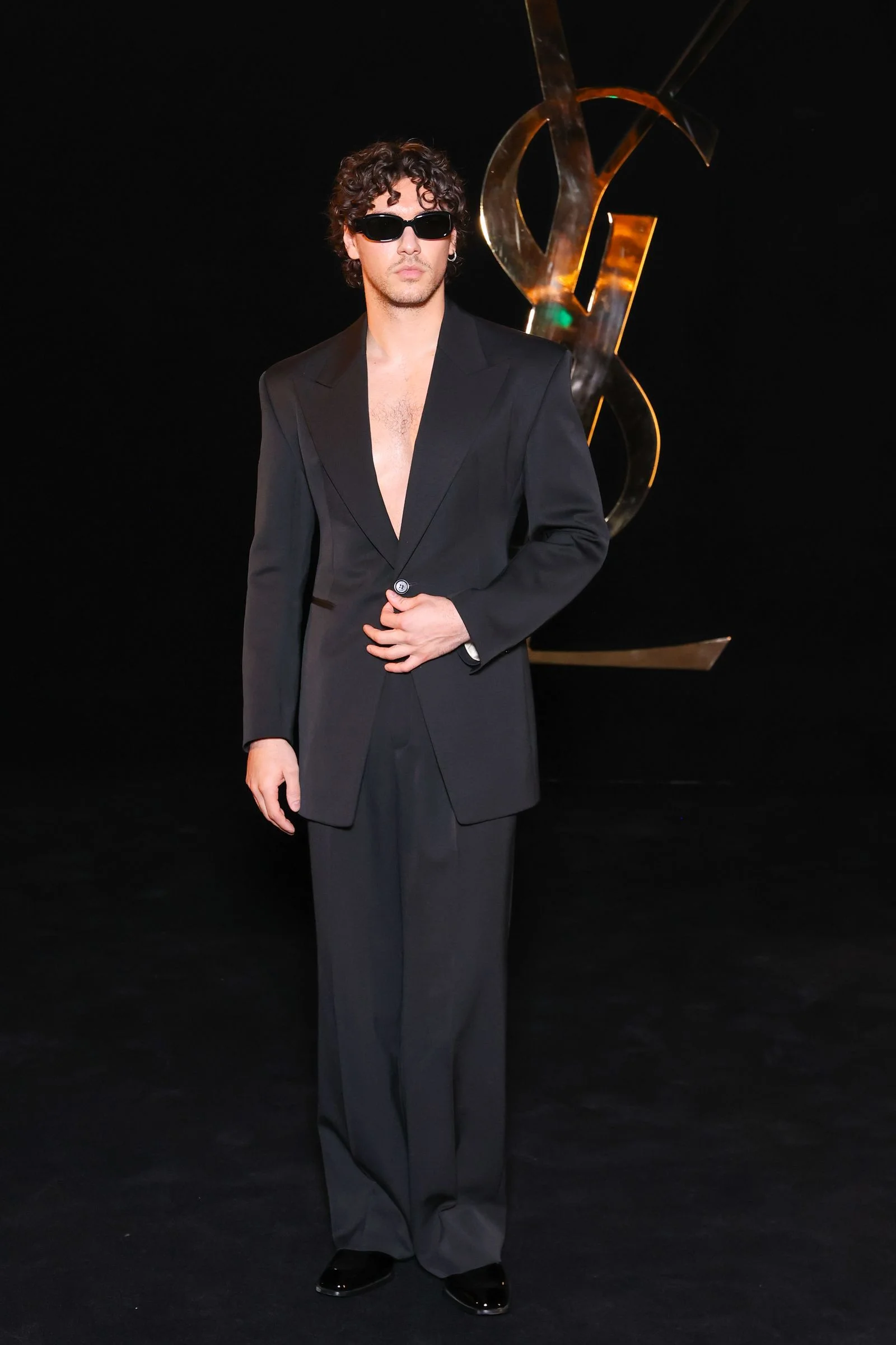 Image may contain Clothing Formal Wear Suit Tuxedo Coat Blazer Jacket Adult Person and Fashion