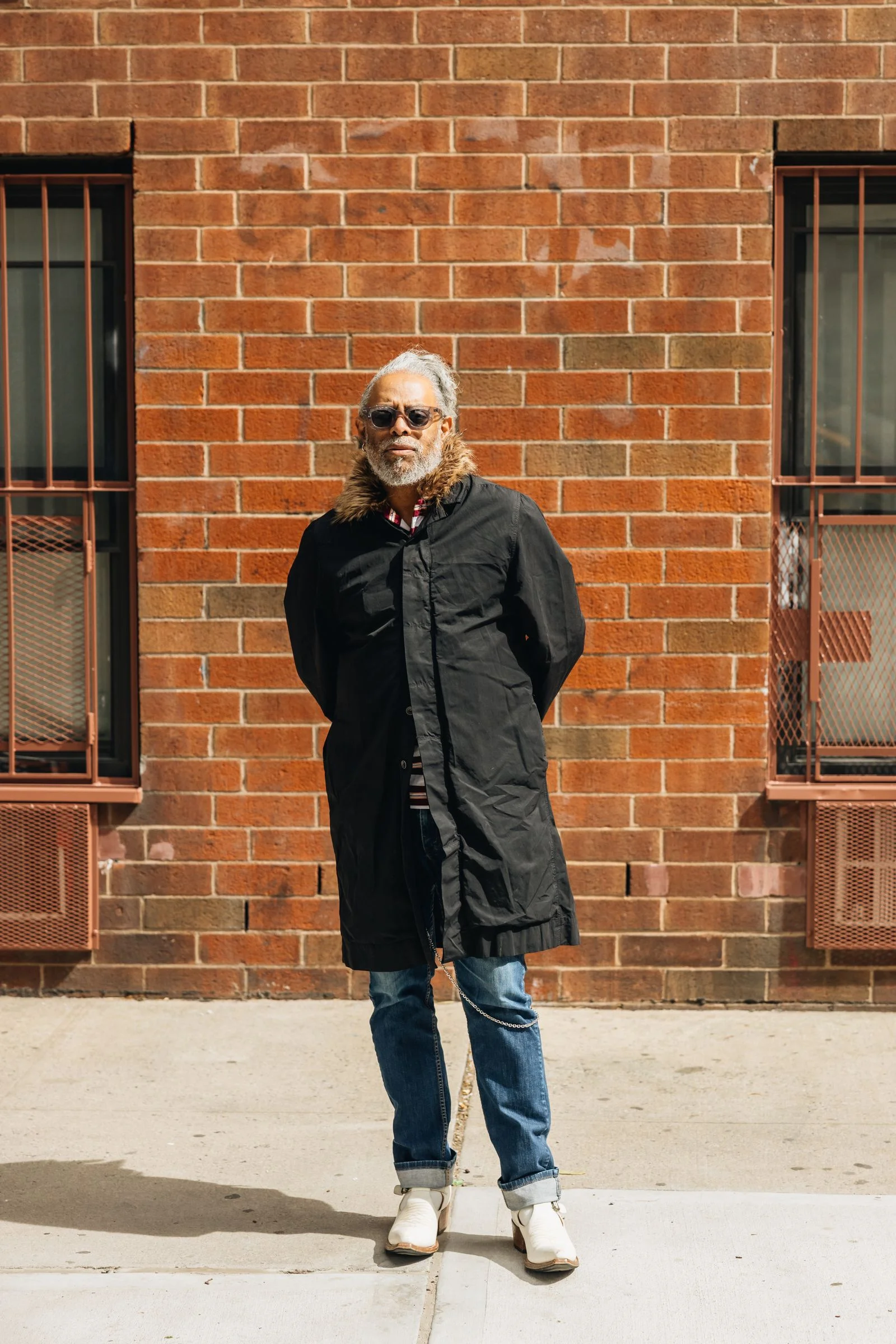Image may contain Coolio Clothing Coat Person Standing Adult and Senior Citizen