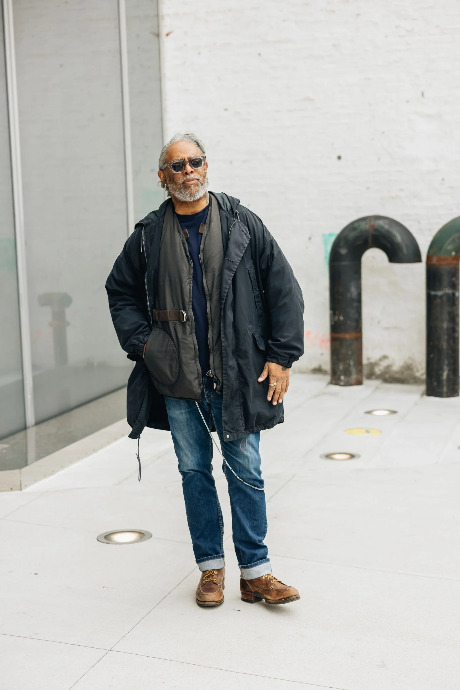 Image may contain Coolio Person Standing Clothing Pants Adult Coat and Jeans