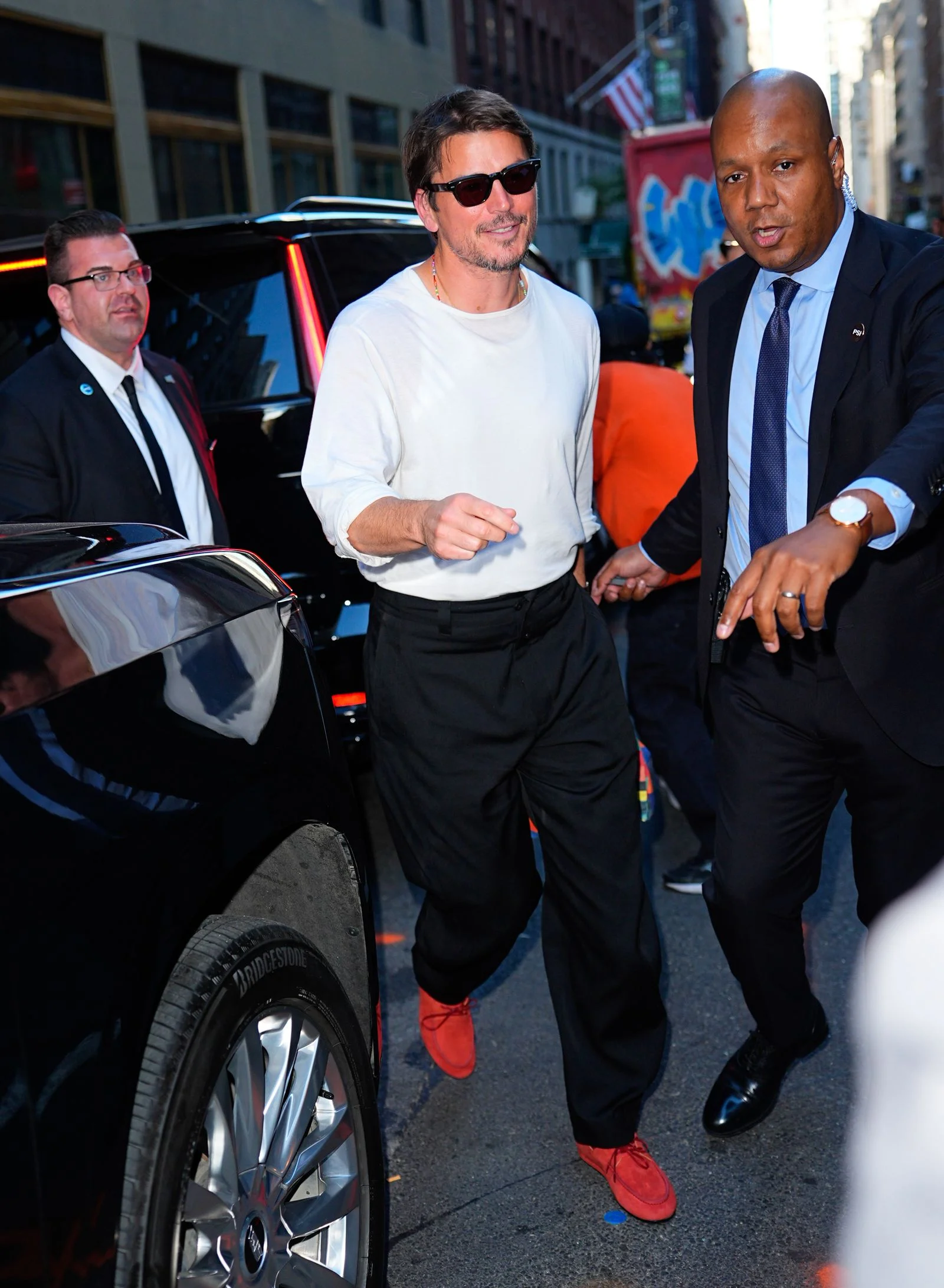 Image may contain Josh Hartnett Accessories Sunglasses Alloy Wheel Car Car Wheel Machine Spoke and Tire