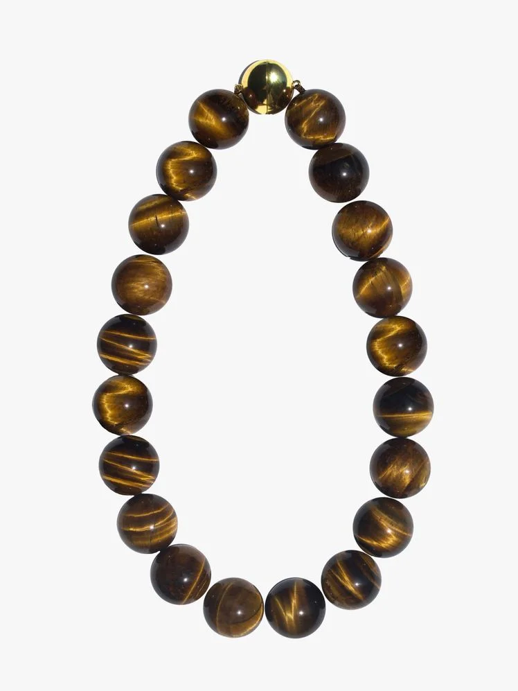 Image may contain: Accessories, Bracelet, Jewelry, Bead, Bead Necklace, and Ornament