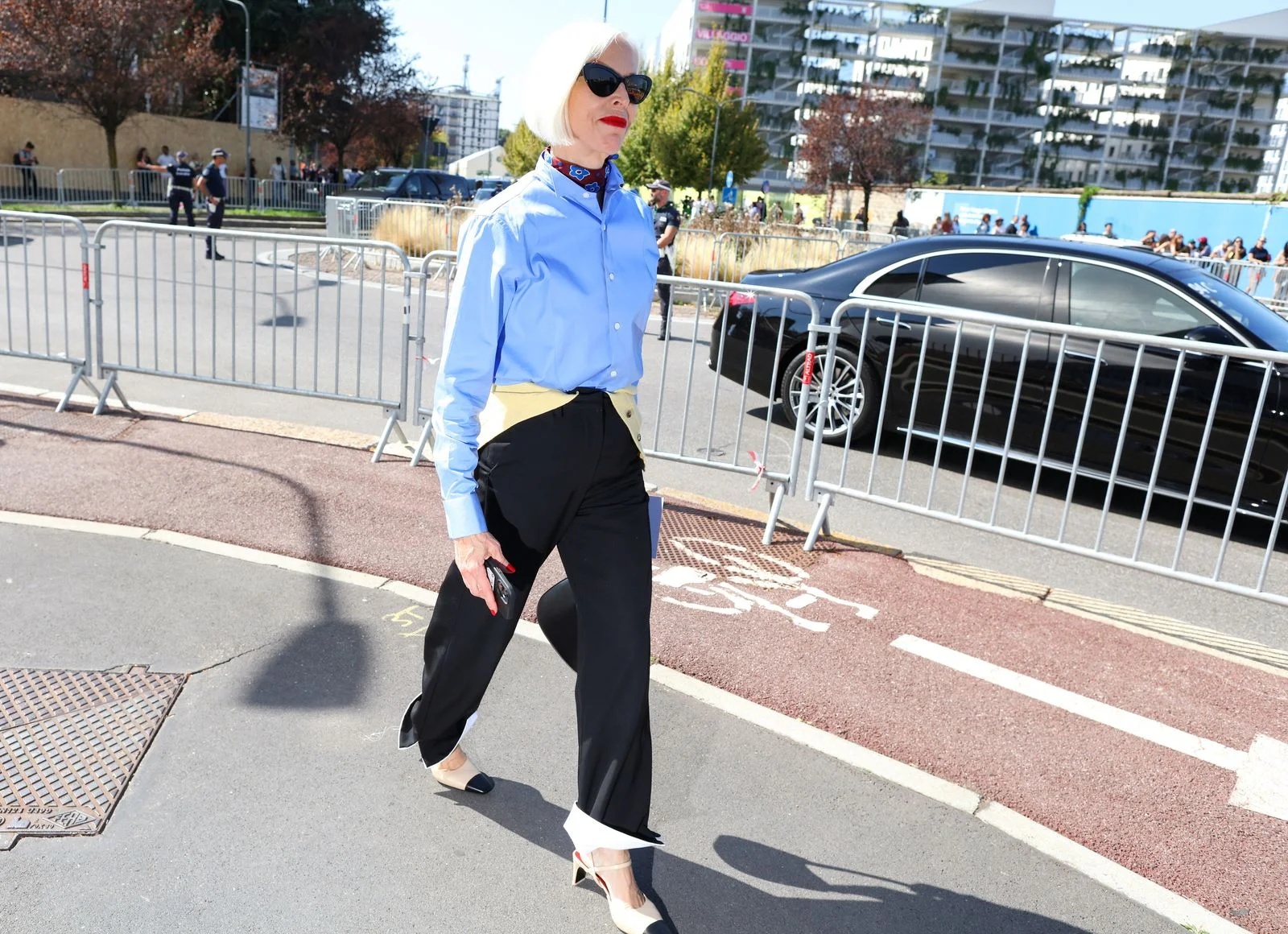 Image may contain Clothing Pants Pedestrian Person Car Transportation Vehicle Footwear Shoe Machine and Wheel