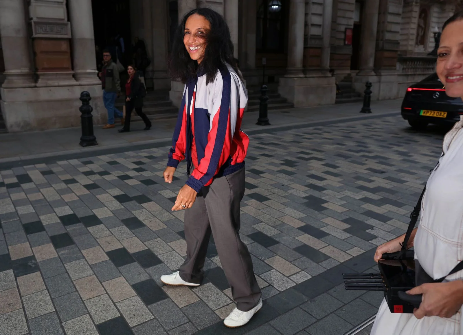 Image may contain Mýa Person Walking Standing Teen Adult Pedestrian Clothing Footwear Shoe Coat Jacket and Pants