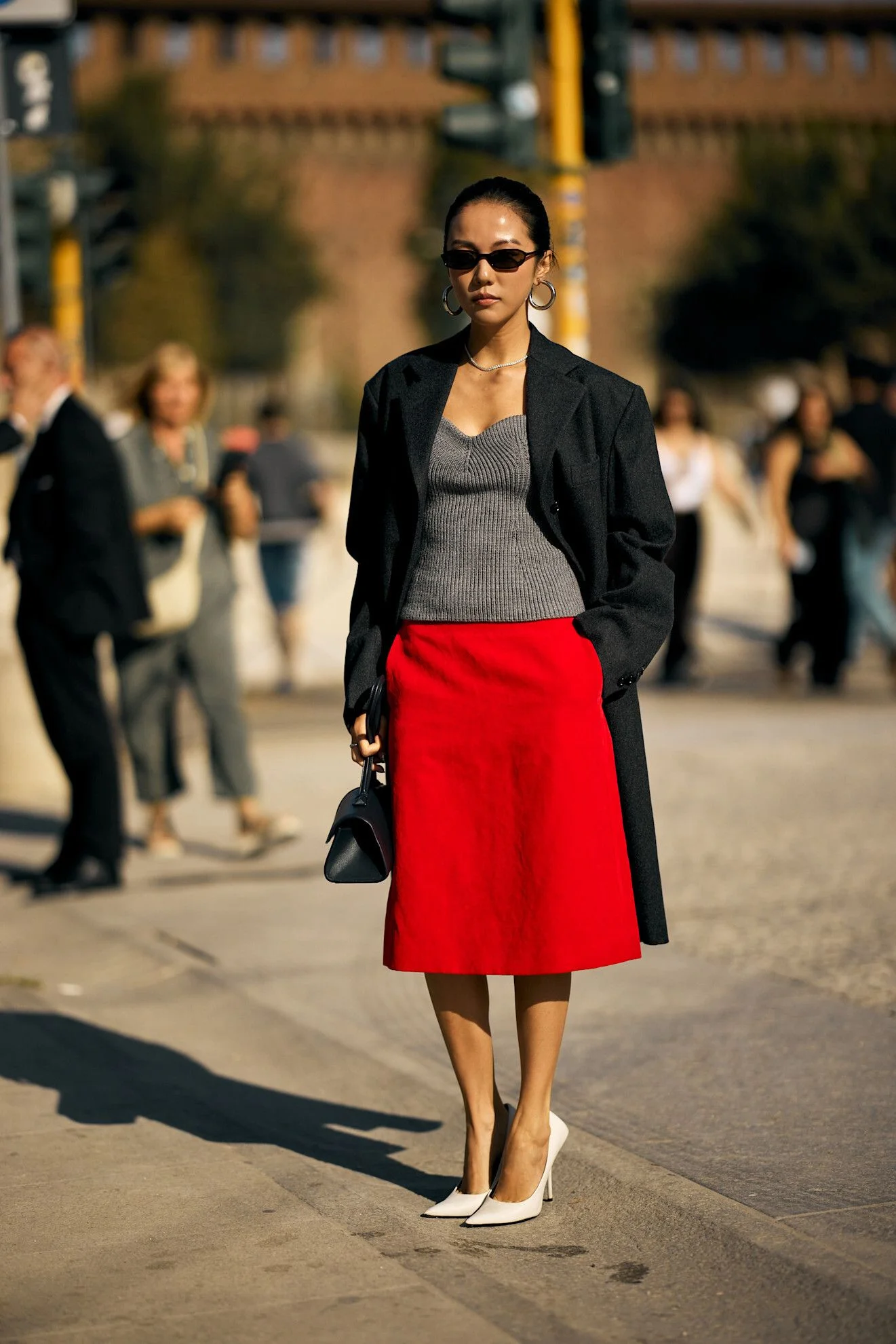 Image may contain Clothing Skirt Person Adult Coat Pedestrian Blazer and Jacket