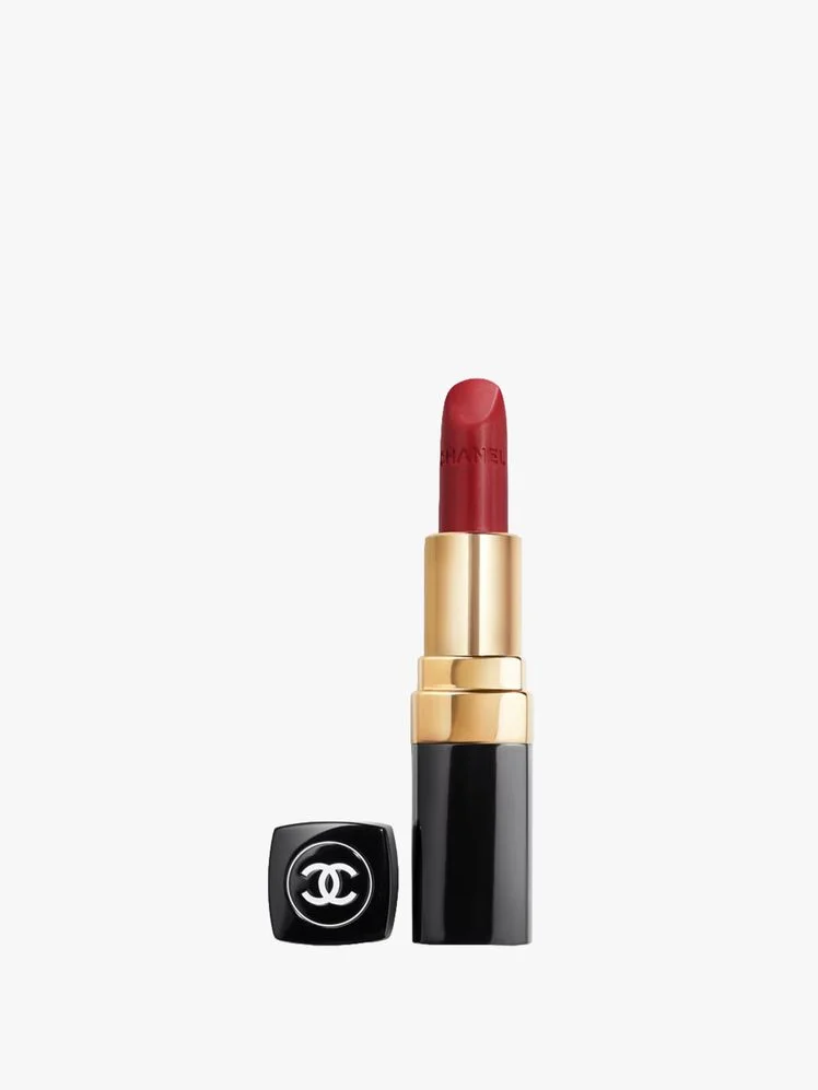 Image may contain: Cosmetics, Lipstick, Hockey, Ice Hockey, Ice Hockey Puck, Rink, Skating, and Sport