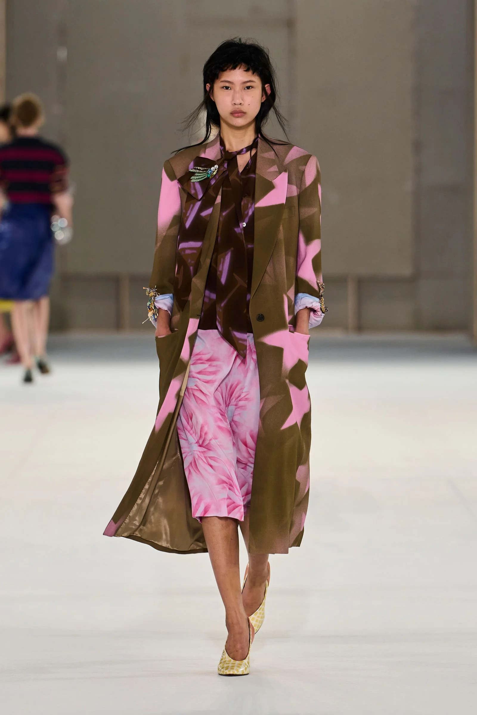 Image may contain Fashion Clothing Coat Adult Person and Dress