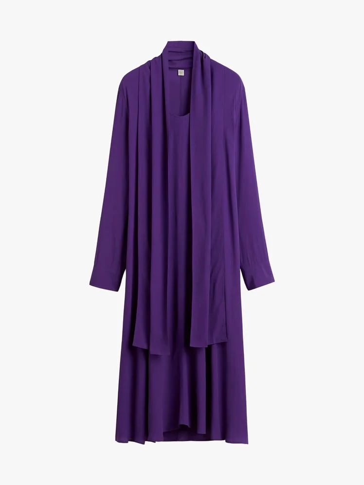 Image may contain: Blouse, Clothing, Long Sleeve, Sleeve, Fashion, Robe, Dress, People, Person, Formal Wear, and Coat