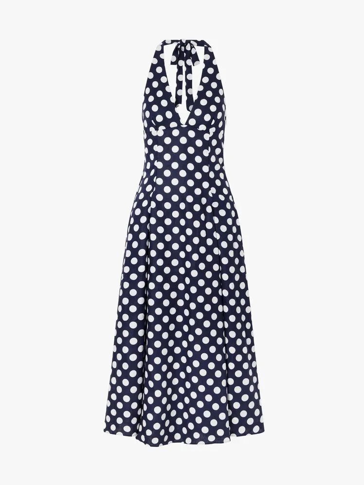 Image may contain: Pattern, Clothing, Coat, Dress, and Polka Dot