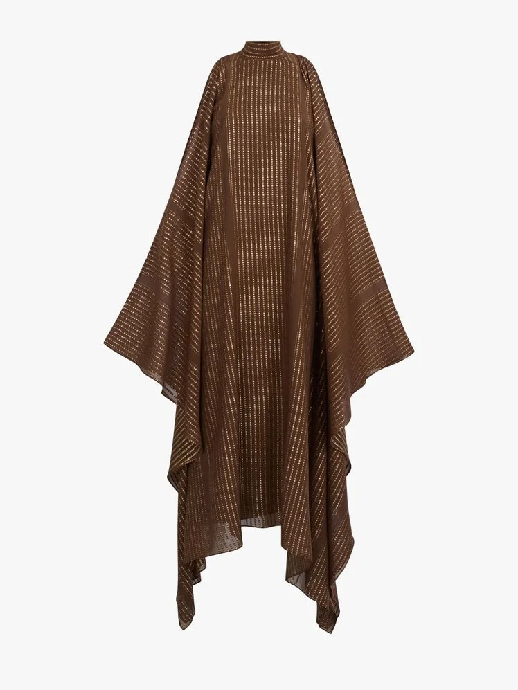 Image may contain: Fashion, Cloak, Clothing, Poncho, and Coat