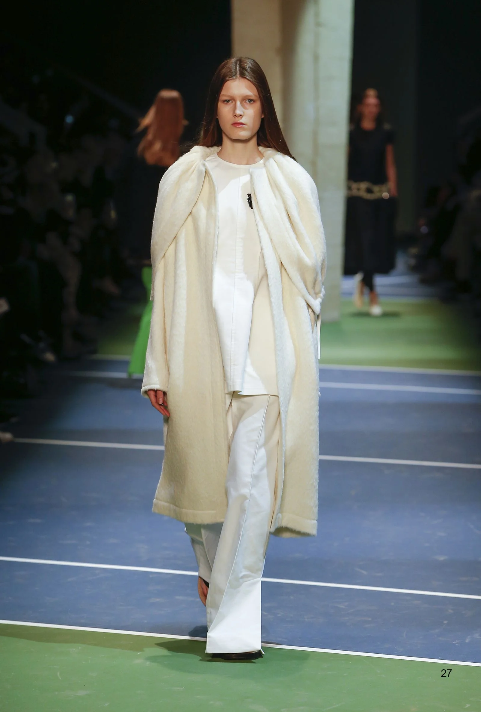 This image may contain Clothing Coat Apparel Human Person Fashion Runway and Sleeve