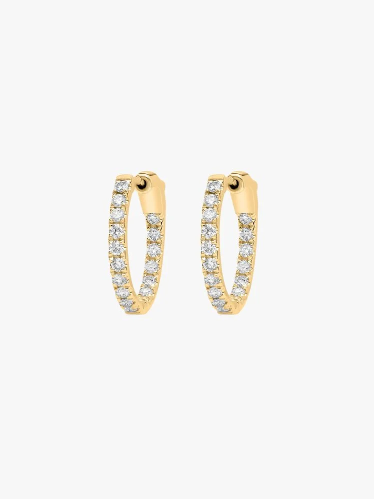 Image may contain: Accessories, Diamond, Gemstone, Jewelry, Earring, Gold, and Ring