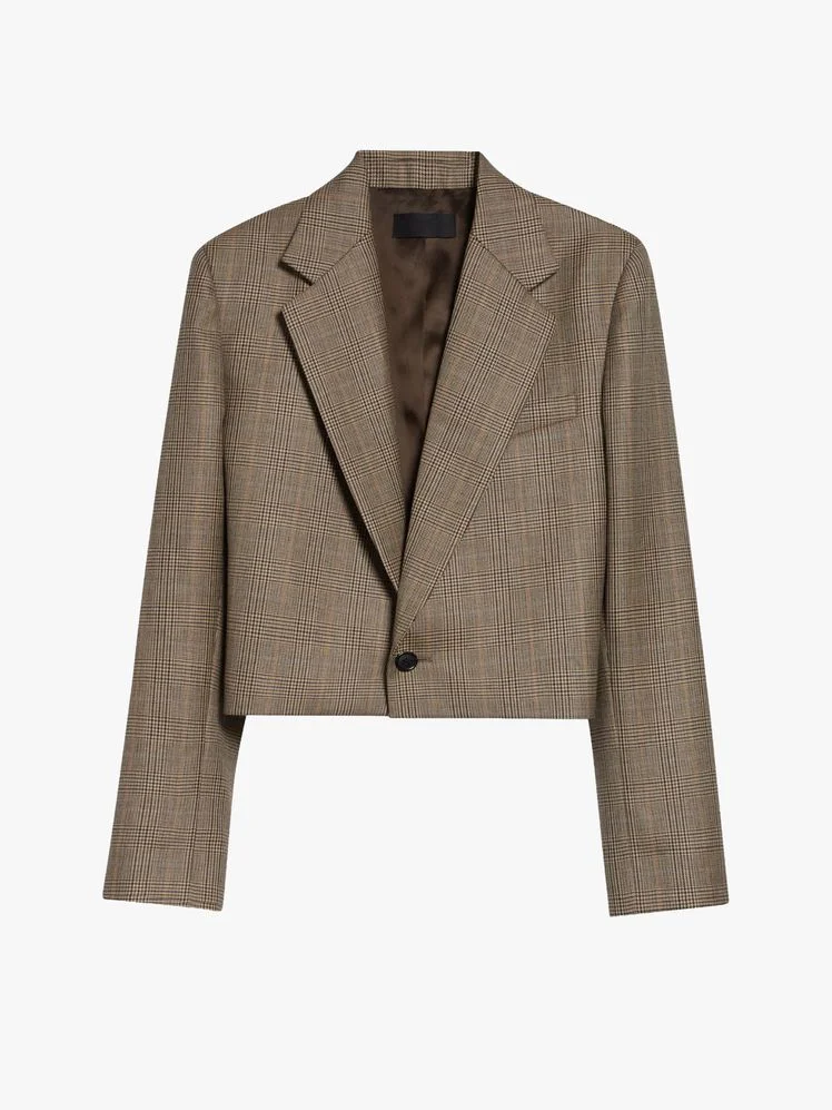 Image may contain: Blazer, Clothing, Coat, Jacket, Formal Wear, and Suit