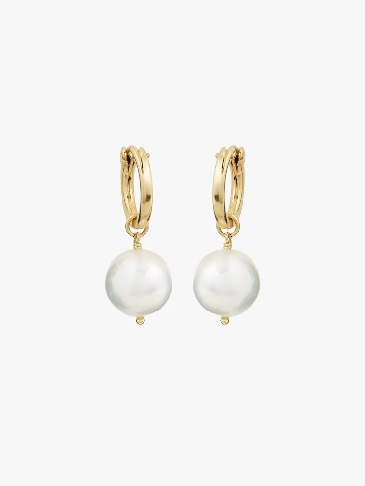 Image may contain: Accessories, Earring, Jewelry, and Pearl