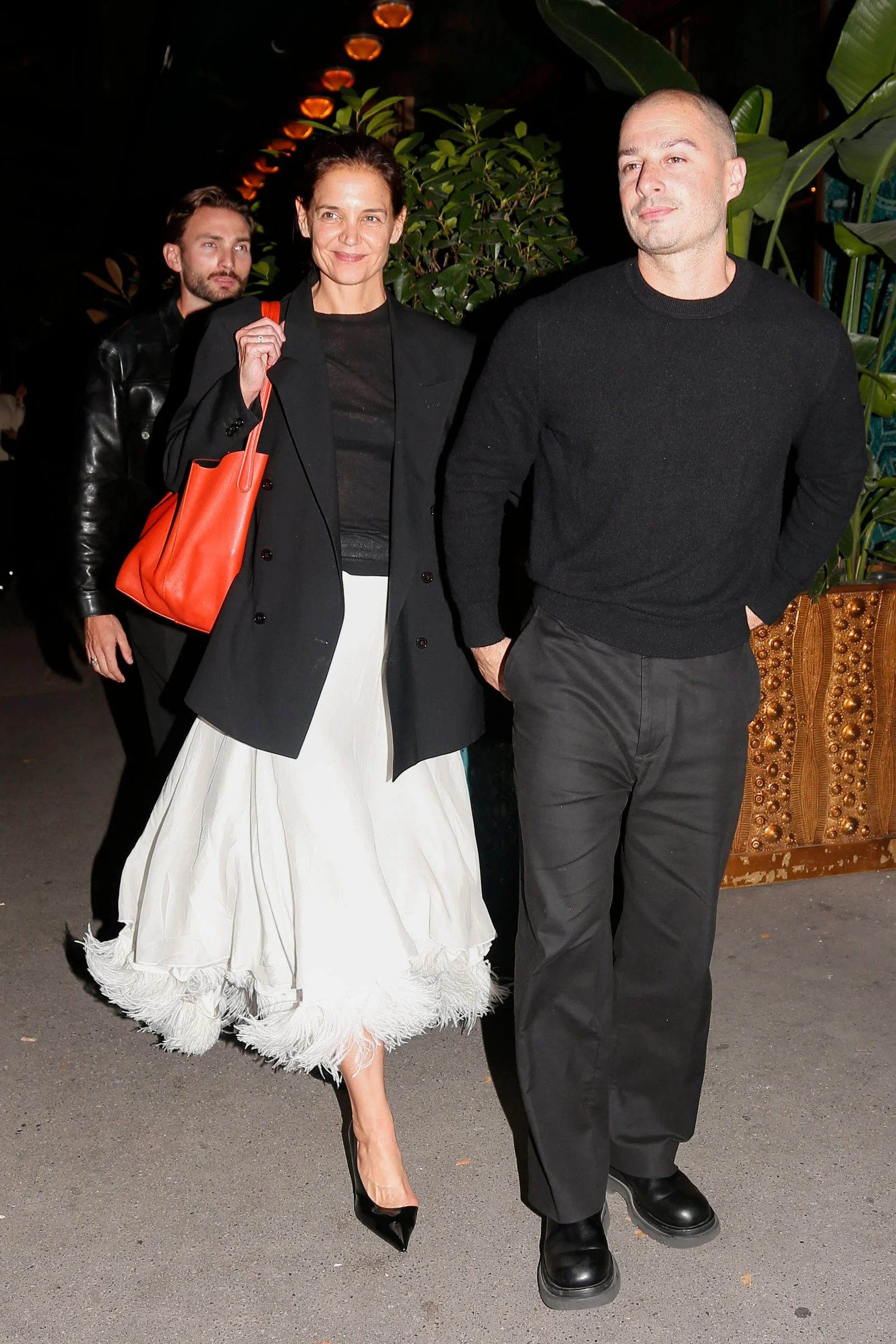 Image may contain Fabri Fibra Katie Holmes Clothing Coat Jacket Blazer Accessories Bag Handbag Fashion and Person