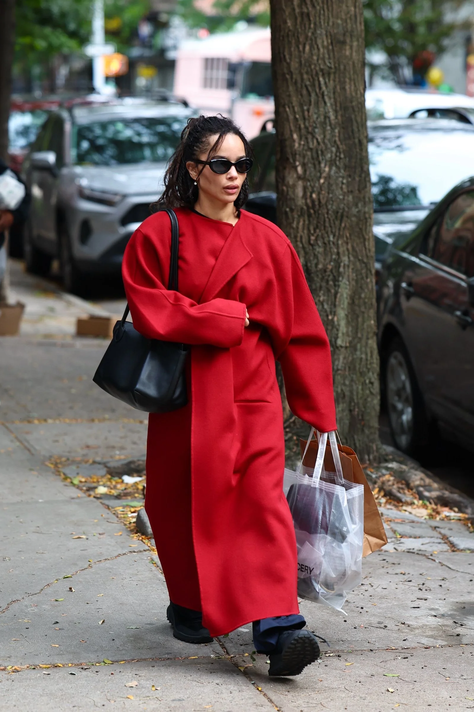 Image may contain Zoë Kravitz Clothing Coat Adult Person Accessories Bag and Handbag