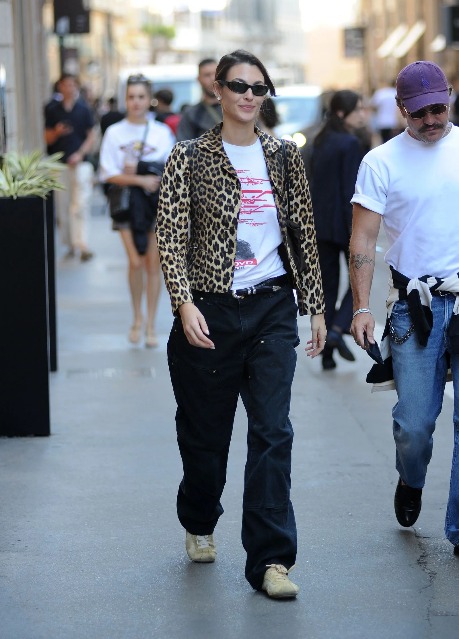 Image may contain Clothing Pants Jeans Pedestrian Person Adult Coat Accessories Glasses Hat Footwear and Shoe