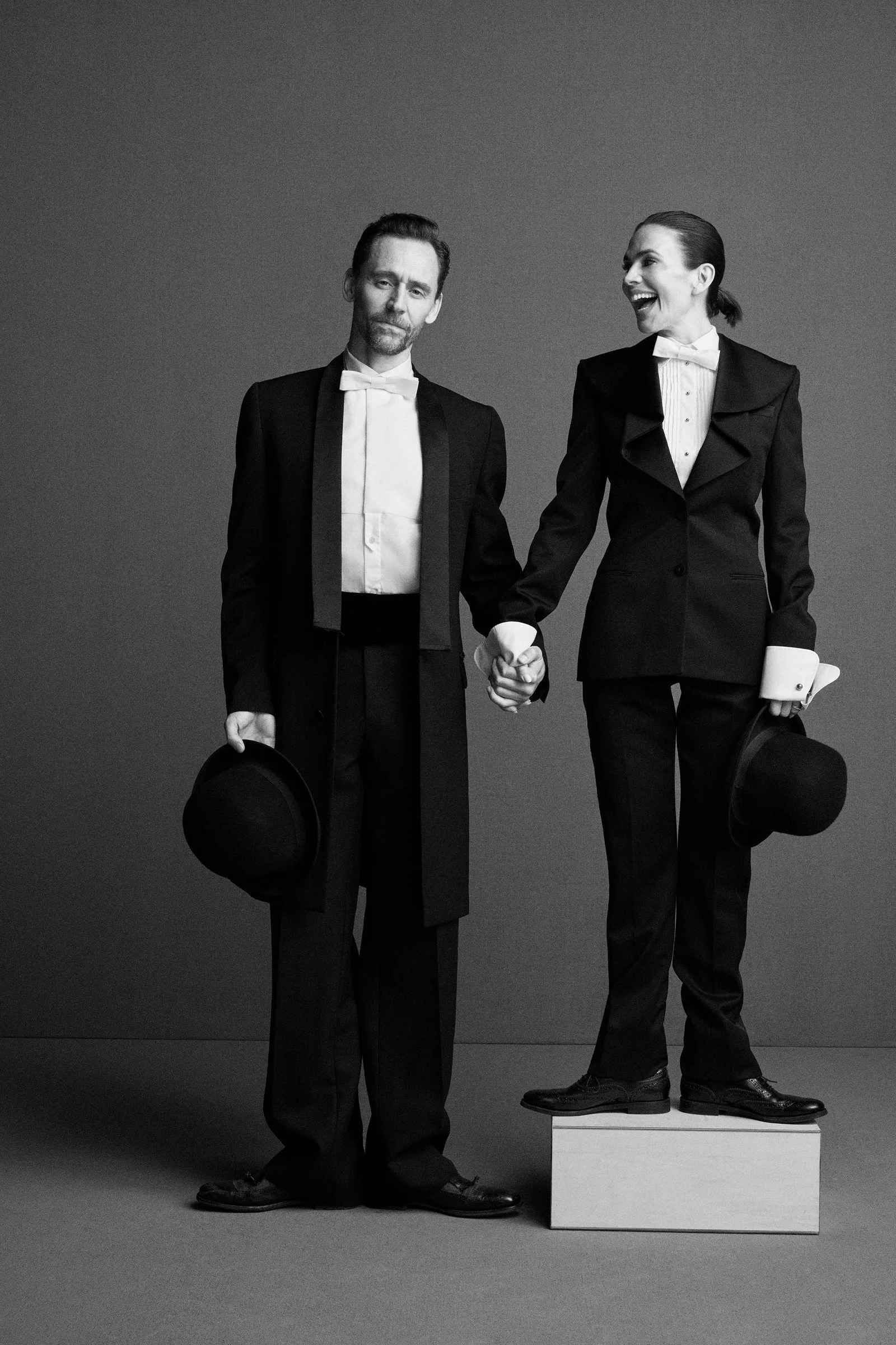 Image may contain Tom Hiddleston Hayley Atwell Clothing Formal Wear Suit Coat Blazer Jacket Adult and Person