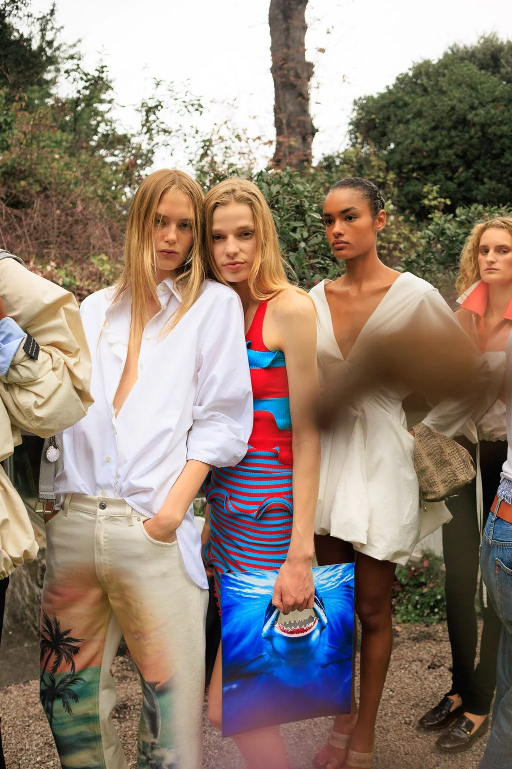 Image may contain Hannah Ferguson Gizele Oliveira Mlina RobertMichon Blouse Clothing Pants Adult Person and Face
