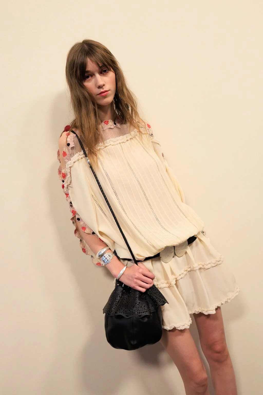 Image may contain Kaiya Jones Blouse Clothing Accessories Bag Handbag Dress Adult Person Purse and Fashion