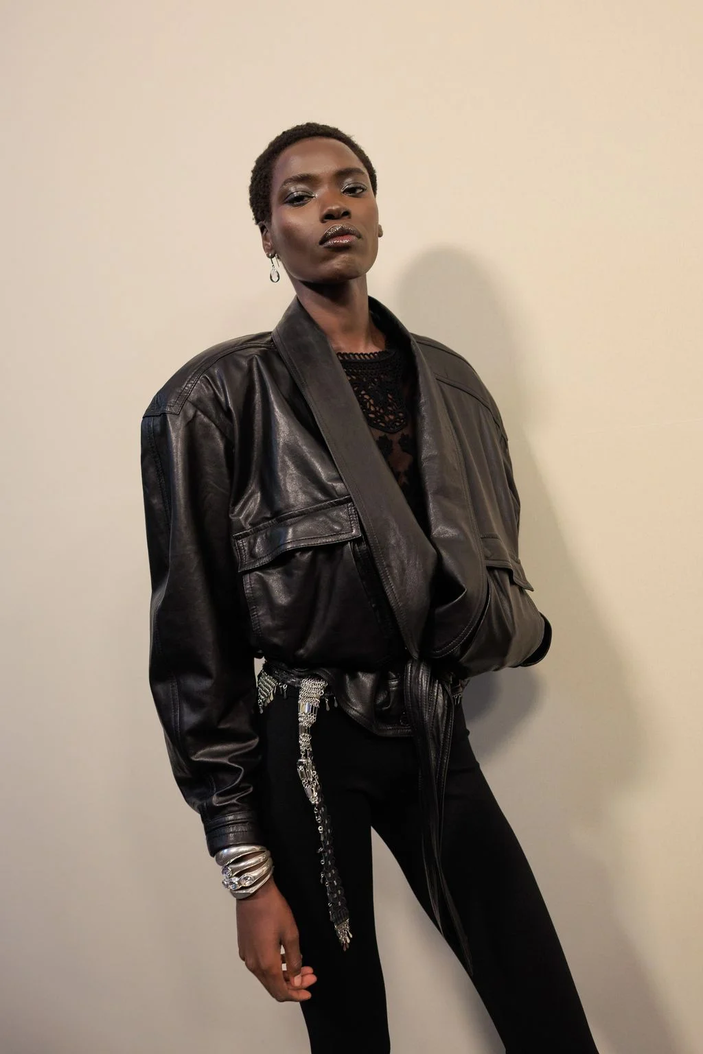 Image may contain Clothing Coat Jacket Adult Person Face Head Photography and Portrait