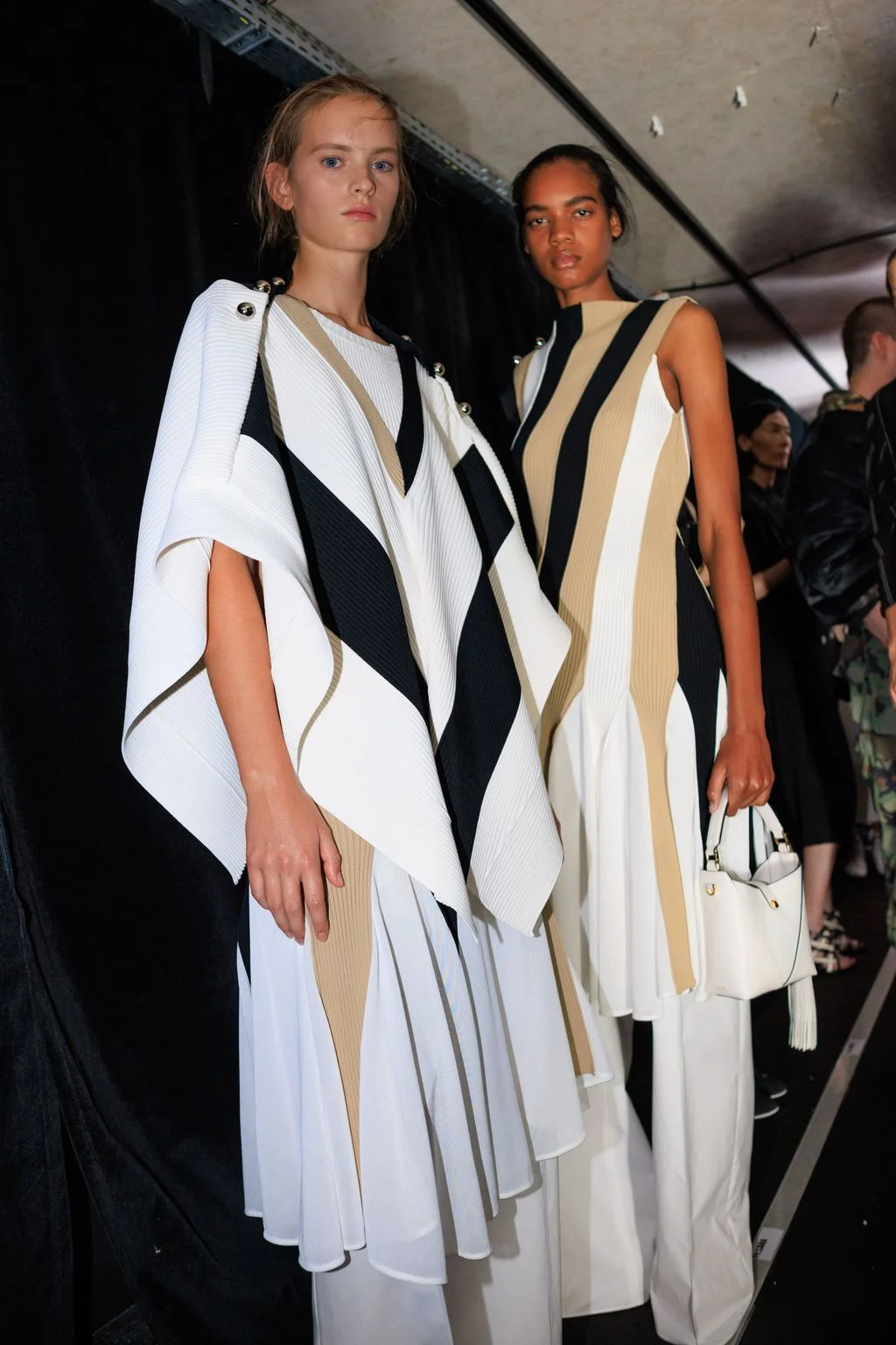 Image may contain Lizzie Kelly Dechen ShakDagsay Fashion People Person Clothing Dress Adult Coat and Accessories