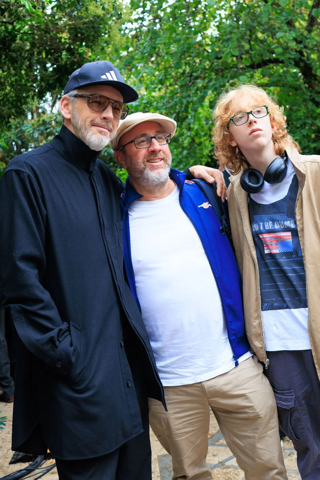 Image may contain Blazer Clothing Coat Jacket Face Head Person Photography Portrait Accessories and Glasses