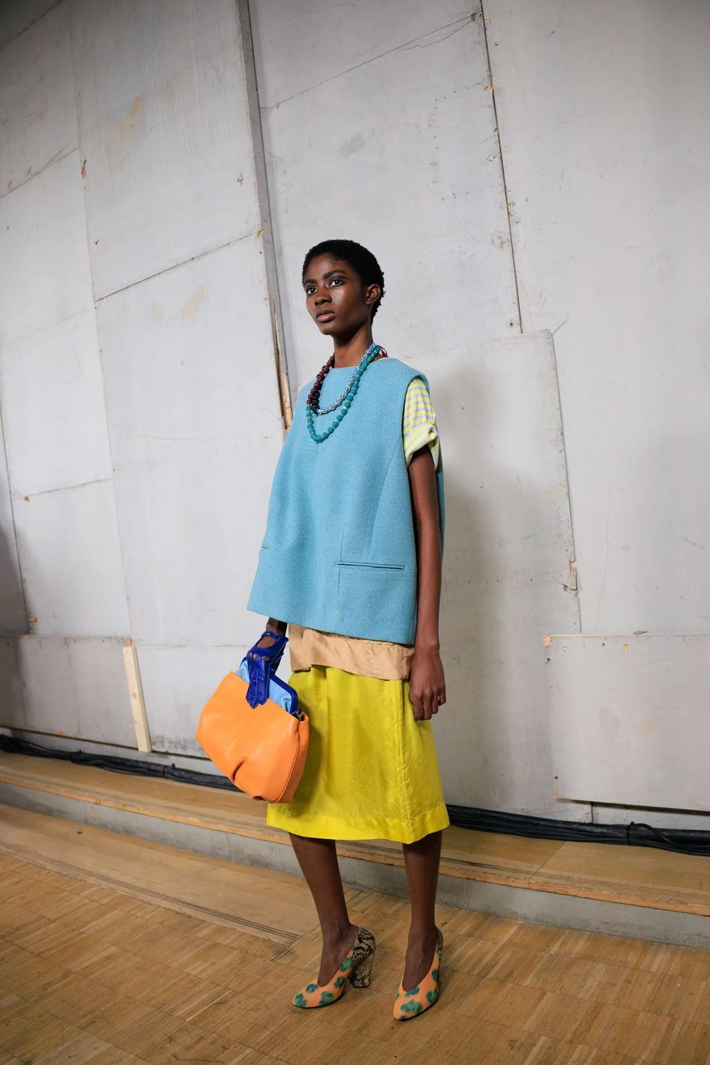 Image may contain Clothing Sleeve Skirt Person Standing Face and Head