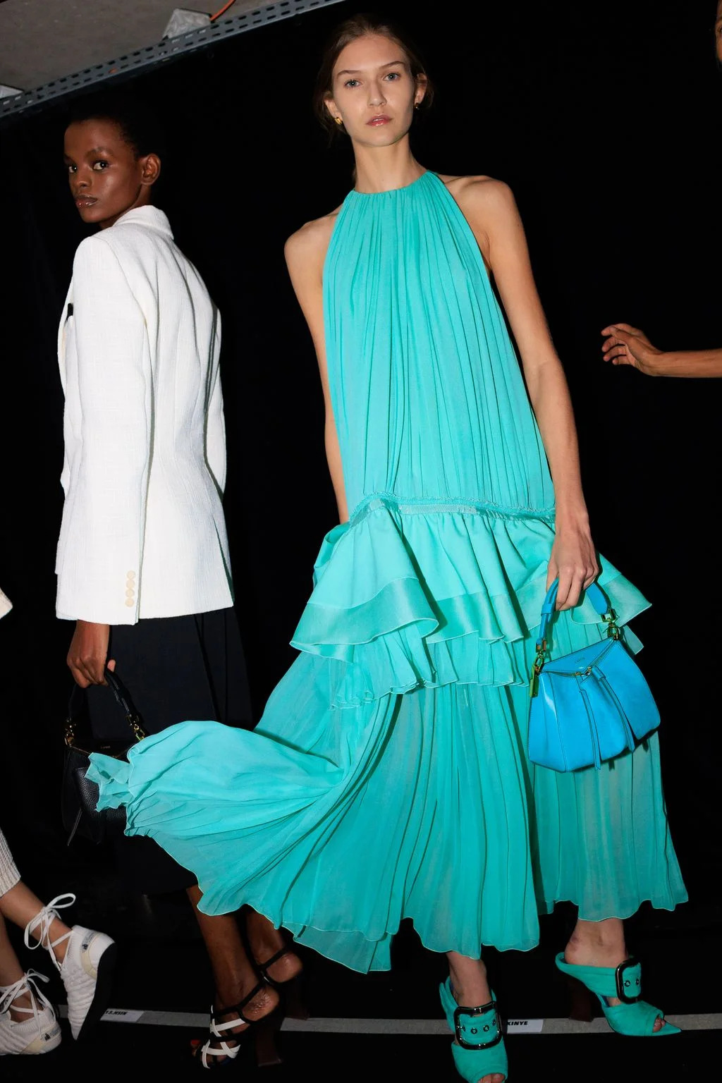 Image may contain Carolyn Stotesbery Clothing Dress Evening Dress Formal Wear Adult Person Fashion and Coat