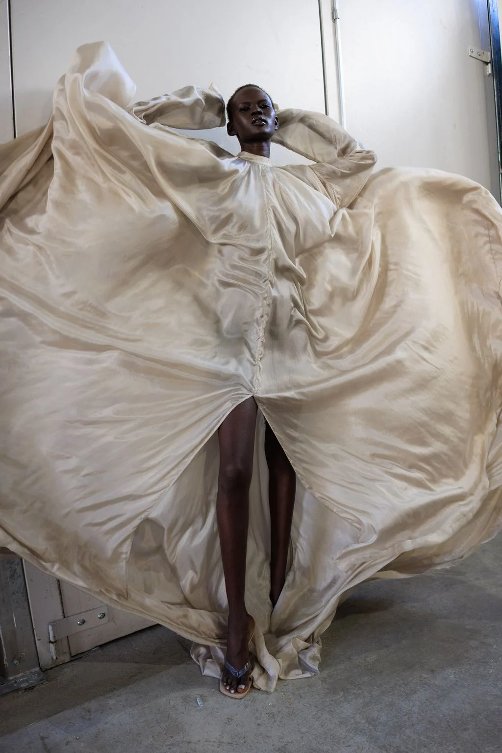 Image may contain Alek Wek Blanket Adult Person Face and Head