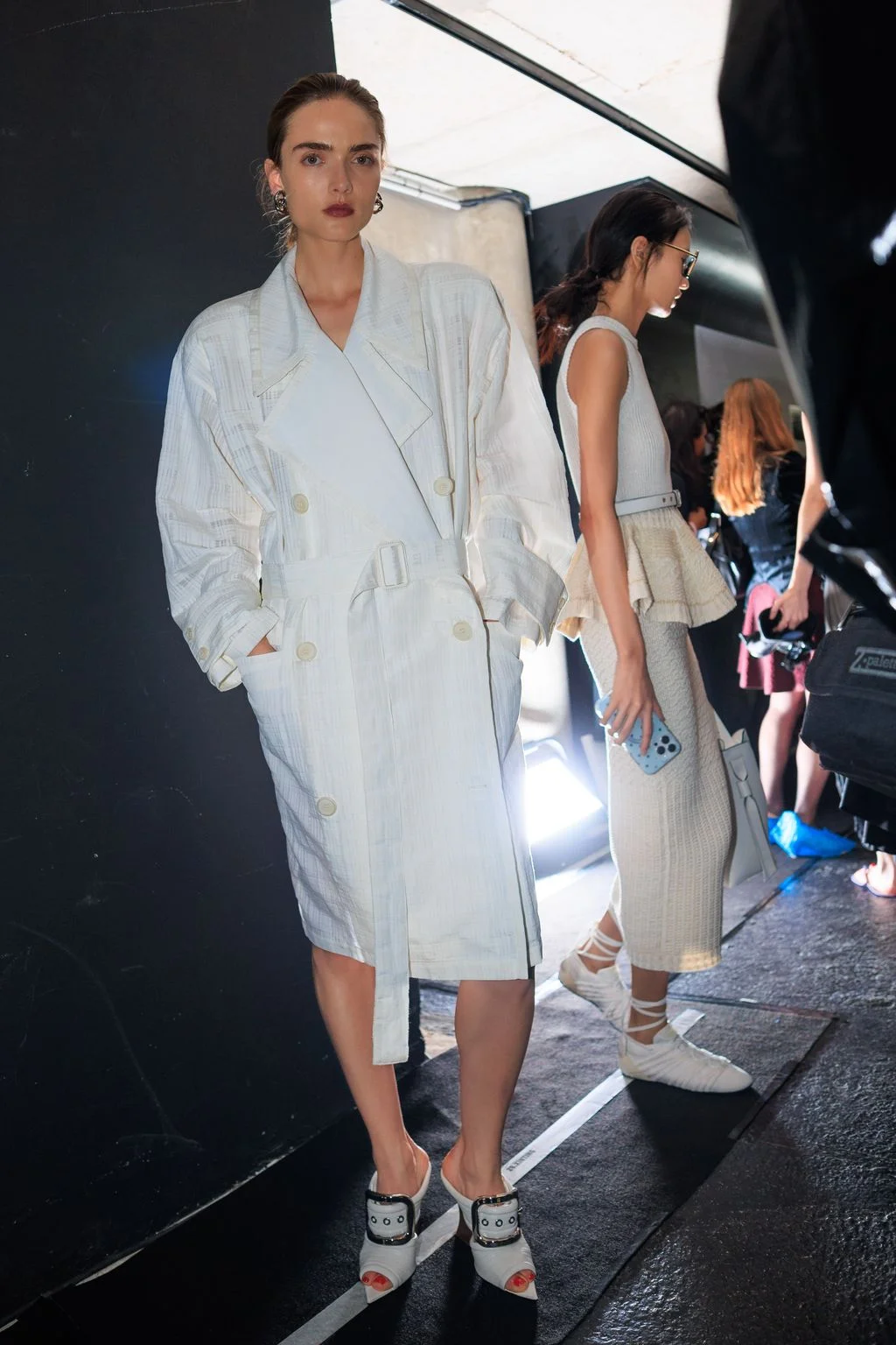 Image may contain Sonny Zhou Clothing Coat Person Adult Footwear and Shoe