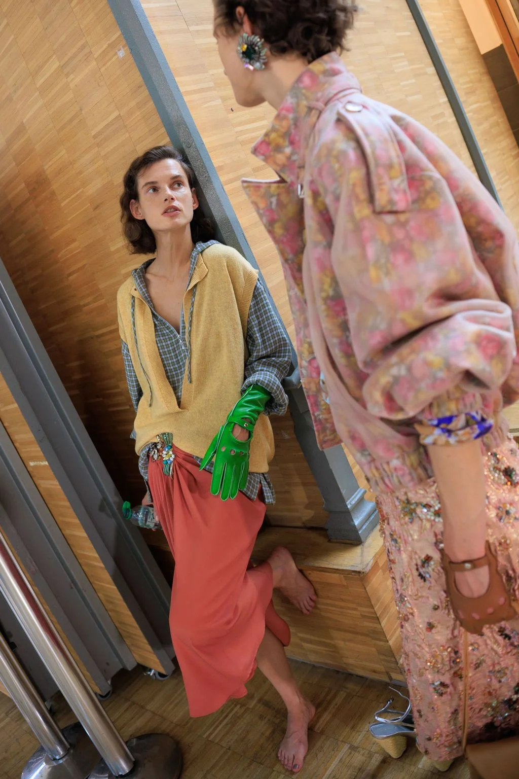 Image may contain Adult Person Blouse Clothing Glove Face Head Sleeve and Dress