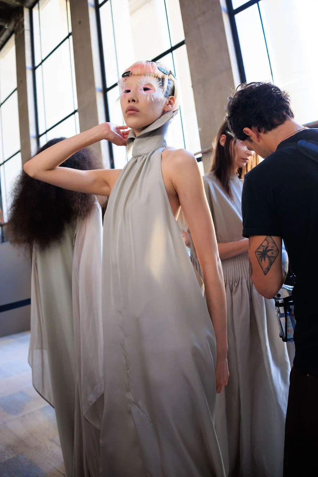 Image may contain Mademoiselle Yulia Bien de Moor Adult Person Clothing Dress Costume Skin Tattoo and Photobombing
