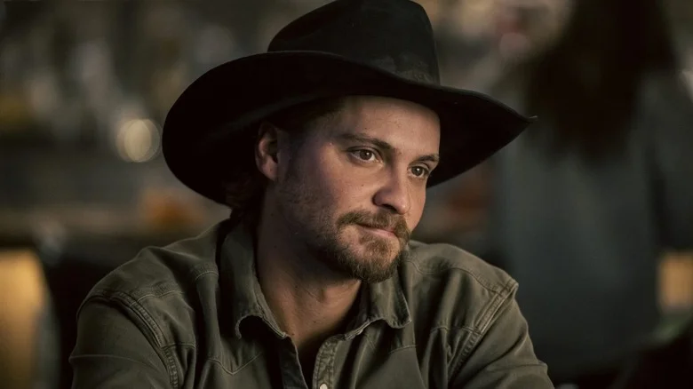 Kaycee looking at someone wearing a cowboy hat in Marshals