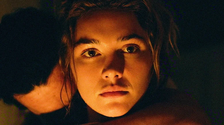 Cathy with Adam's face buried in her neck in East of Eden